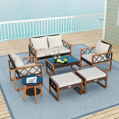 7-Piece Outdoor PE Rattan Patio Furniture Set with Ottomans and Tempered Glass Tables
